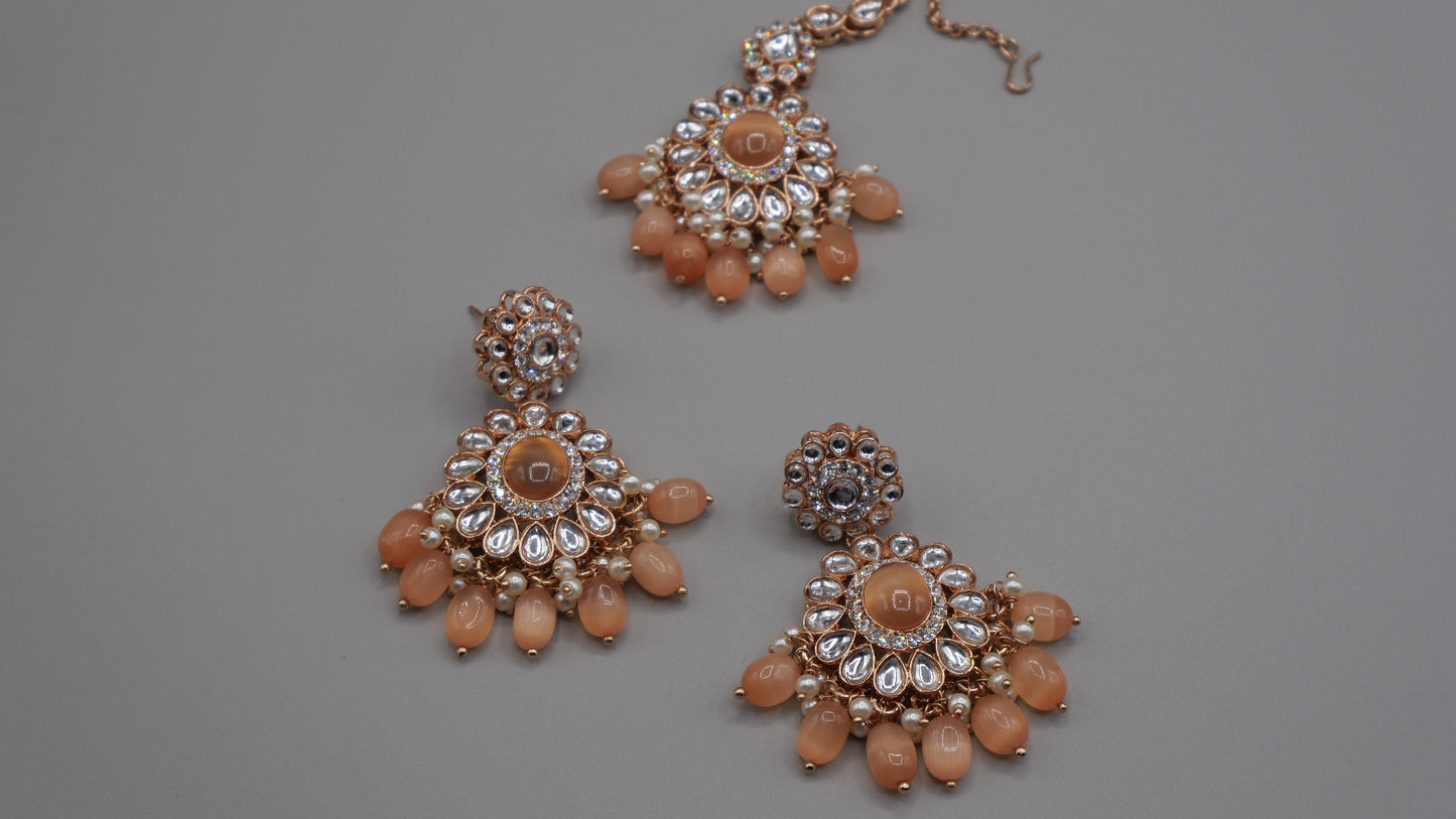 Corvus - Peach Kundan Necklace Set with white pearl chain in the back. Comes with matching Tikka and Earrings