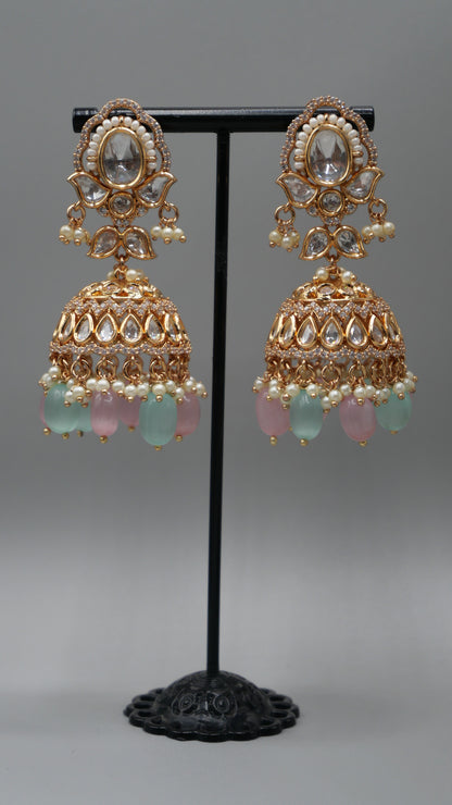 Aurora - A sophisticated Tyaani Kundan set featuring stunning pearl accents and dangling green and pink beads for a captivating display. Includes Jhumka earrings (2.4 inches)