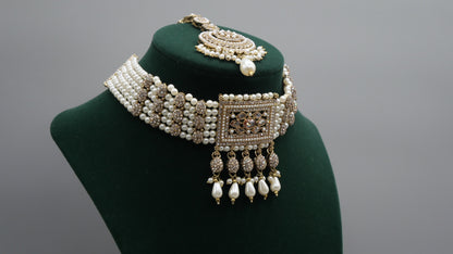 Carat - Gold Polki Choker Set with pearl detail. Comes with Tikka and Jhumka.