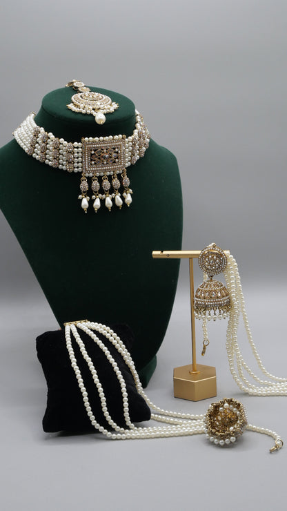 Carat - Gold Polki Choker Set with pearl detail. Comes with Tikka and Jhumka.