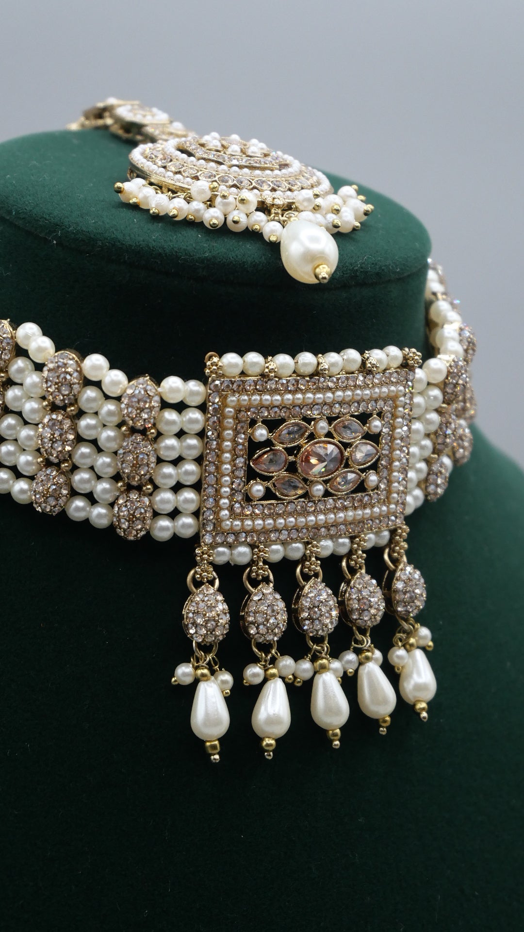 Carat - Gold Polki Choker Set with pearl detail. Comes with Tikka and Jhumka.